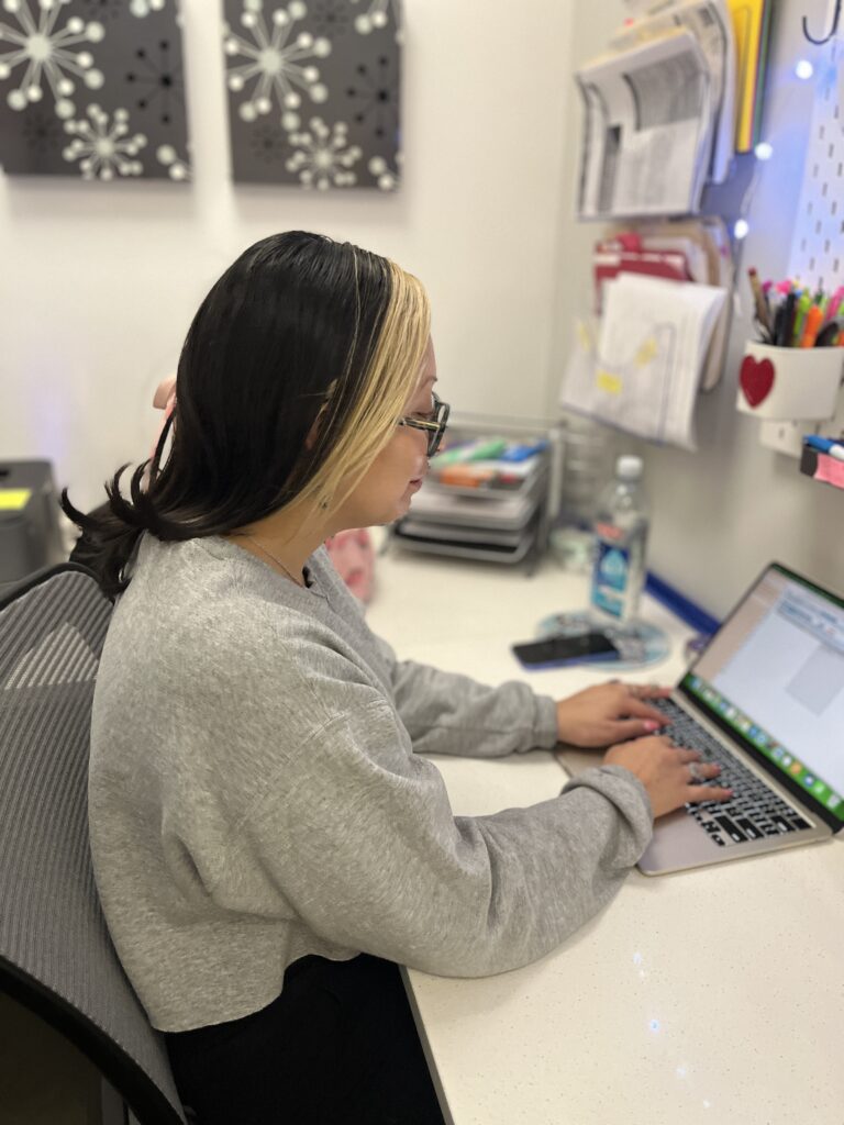 technician priscilla working on the electronic medical record system